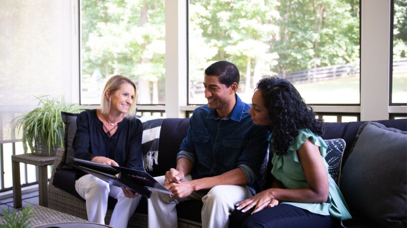 Mark Spain Real Estate agent strategizing with clients on bringing in qualified home buyers