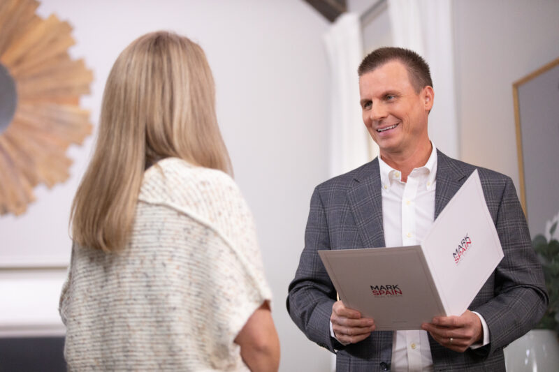 Mark Spain and Laura going over her selling options