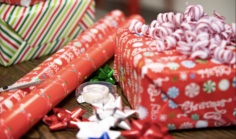 Presents being wrapped for Christmas at Mark Spain Real Estate