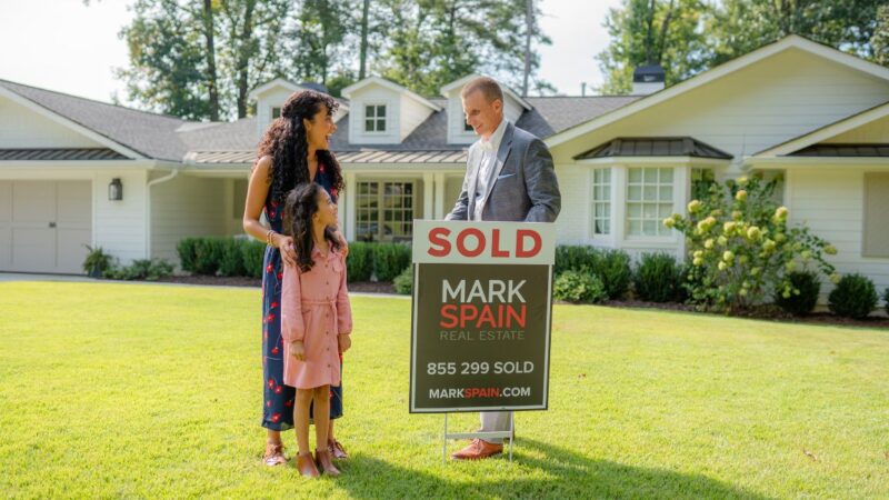 A listing agent helps a homeowner put their property on the market. 