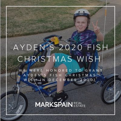Mark Spain Real Estate grants local boy bike for Fish Christmas Wish