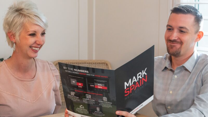 Learn more about selling your home with one of our agents, This agent is going over our selling programs