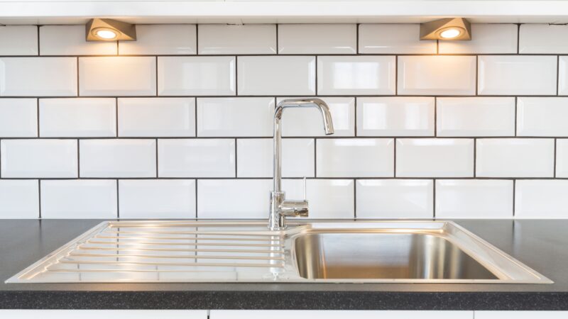 Example of how to increase the value of a home; adding a new faucet and backsplash